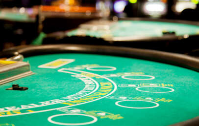 An image of a well lit poker table.