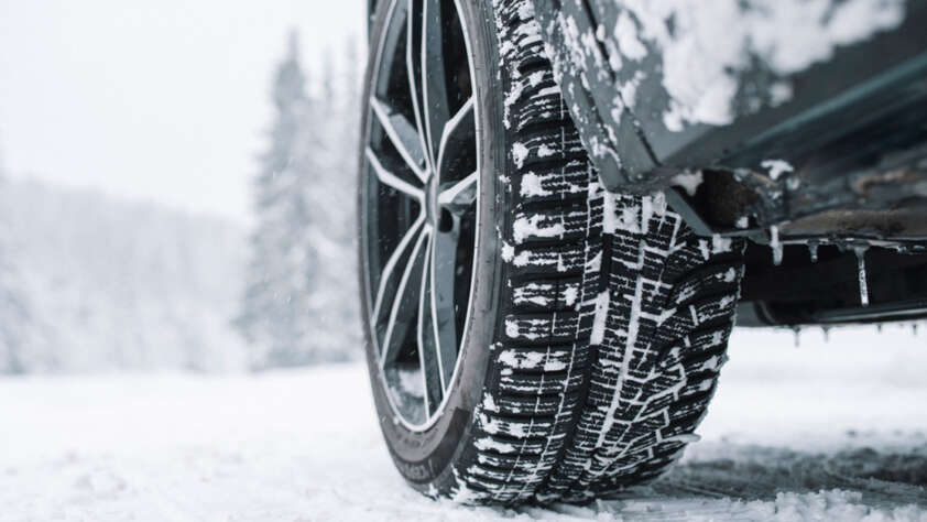 An image of a car that has been fitted with snow tires.