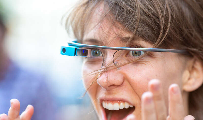 An image of someone using a Google Glass and being very excited about it.