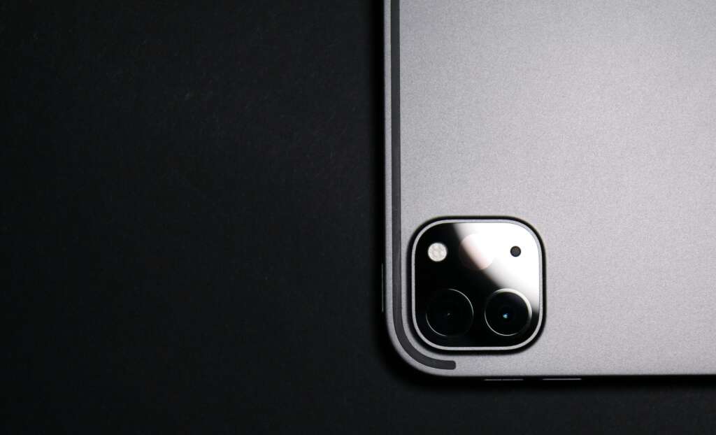 A close-up image of the camera on the back of an iPhone. 