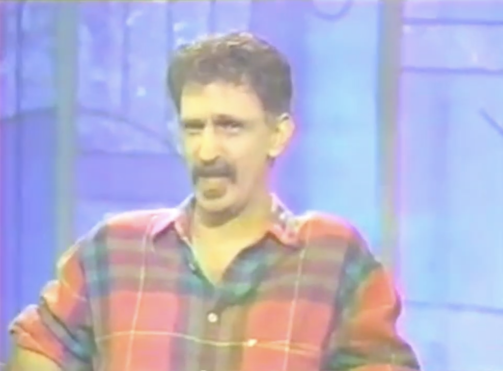 Frank Zappa making a face during an appearance on the Arsenio Hall show