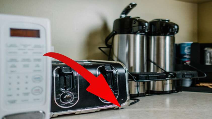A red arrow pointing to hidden product feature on most microwaves.