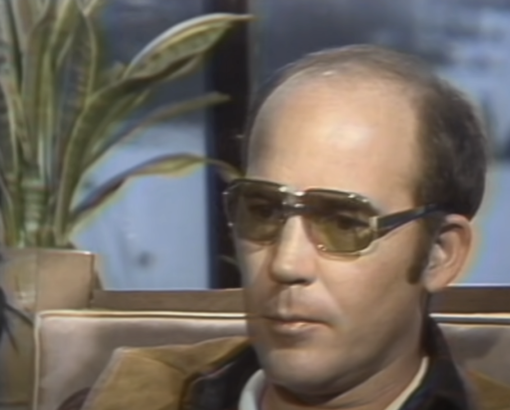 An image of Hunter S. Thompson in sunglasses. 