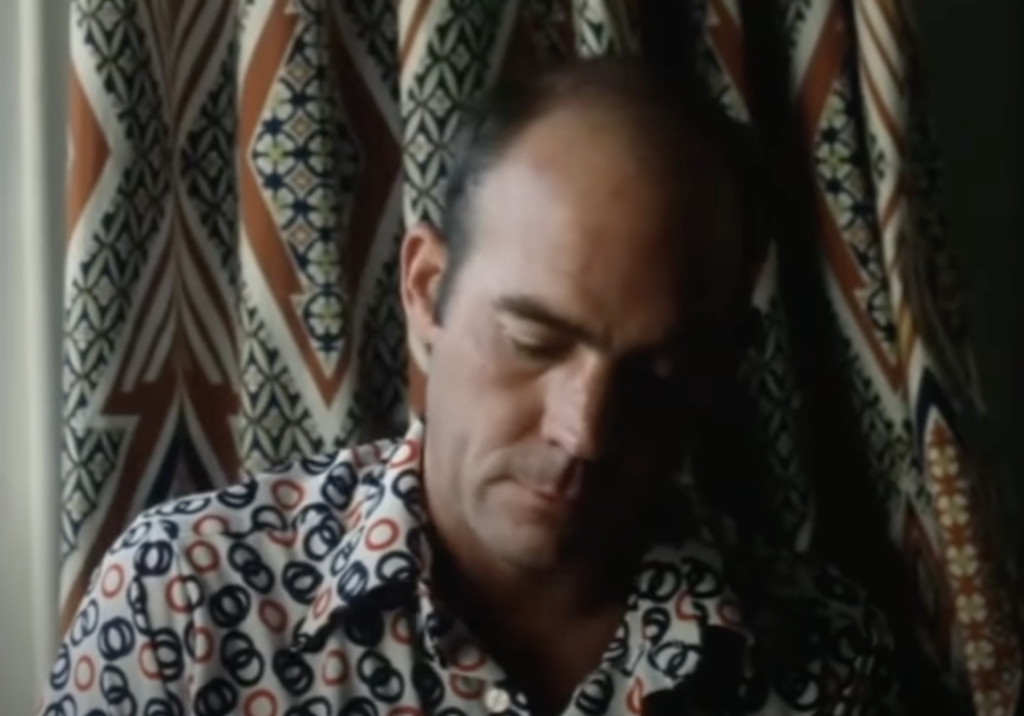 An image of Hunter S. Thompson being interviewed in a funky shirt. 