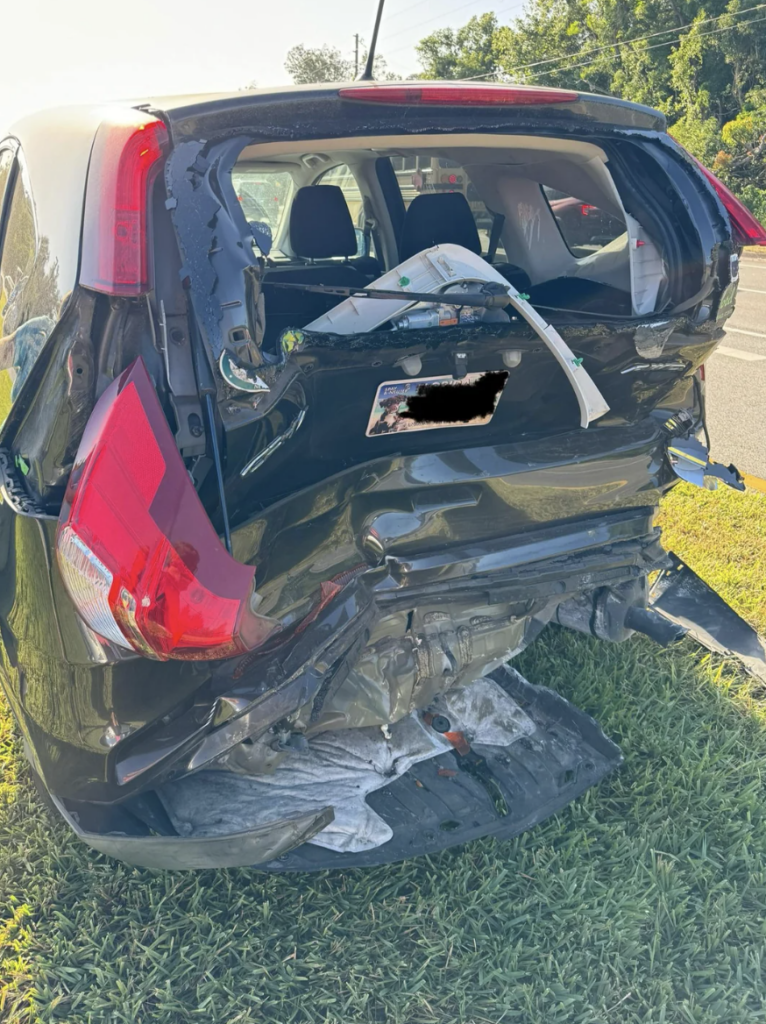 An image of someone who got their car totaled at a stop light. 