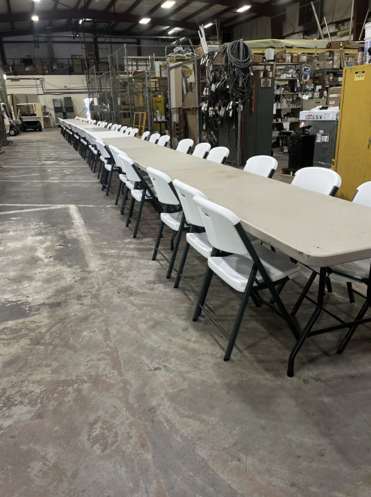 An image of a large table set up for a retirement dinner. 