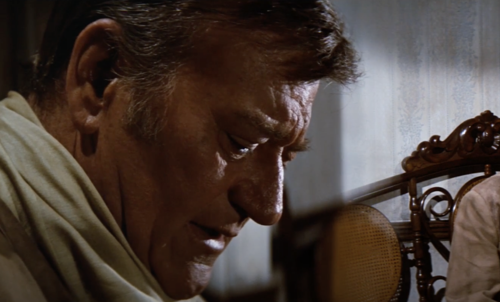 A still and close-up image of John Wayne. 