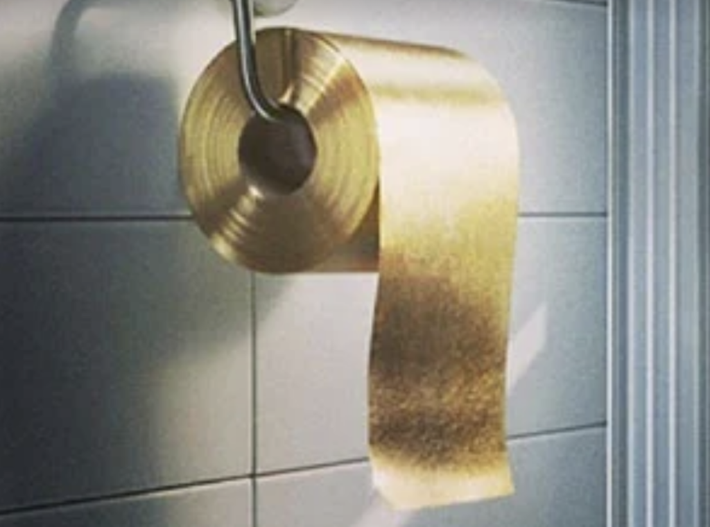 An image of a golden toilet paper roll. 