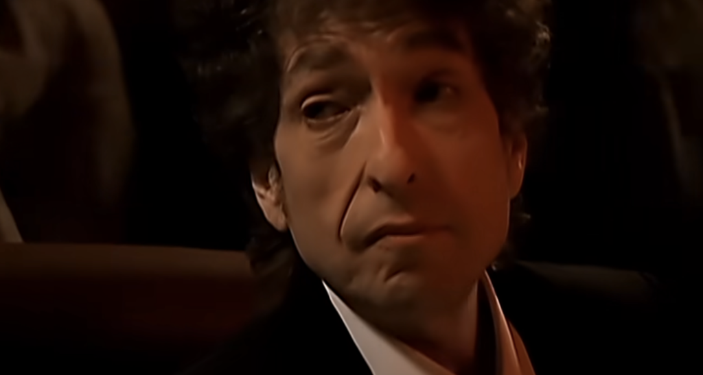 A close-up still of Bob Dylan. 