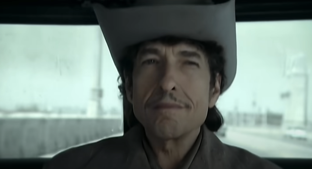 A close-up image of Bob Dylan with his cowboy hat on. 