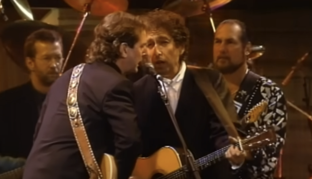 An image of Bob Dylan singing a duet. 