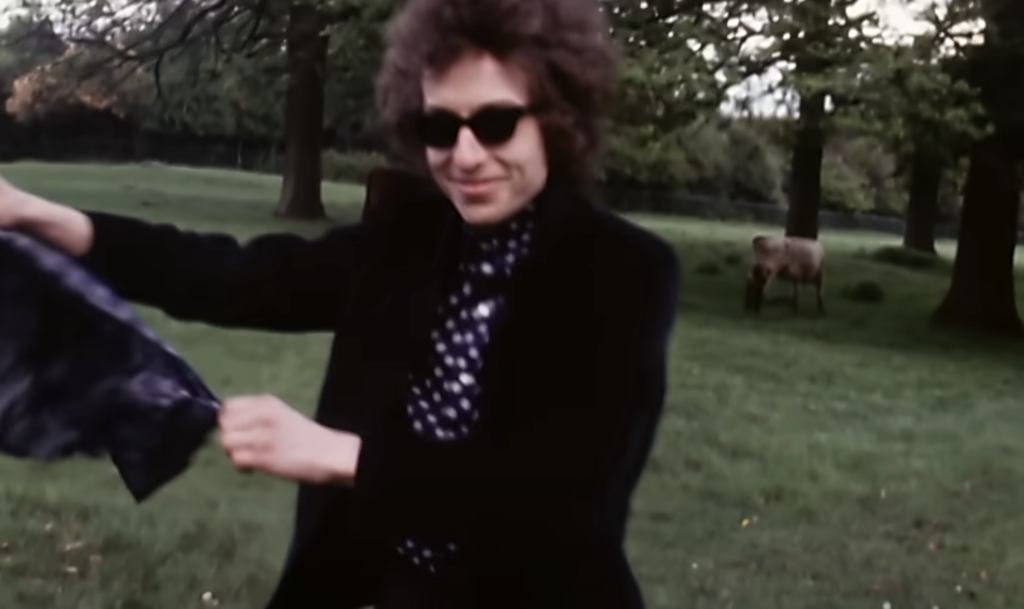 An image of Bob Dylan younger with his sunglasses. 