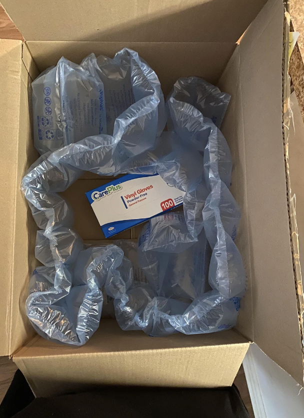 A box from Amazon that's huge, filled with plastic, and only contains vinyl gloves. 