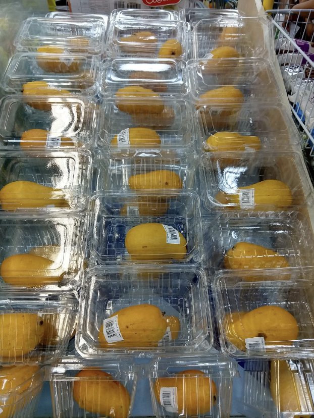 A bunch of fruits that have been individually packaged in plastic. 