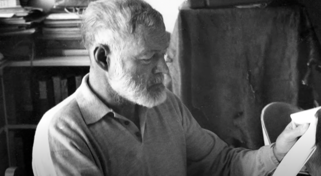 Ernest Hemingway reads from his book. 