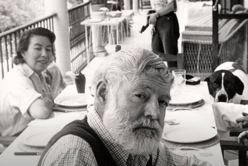 An image of Ernest Hemingway staring at the camera. 