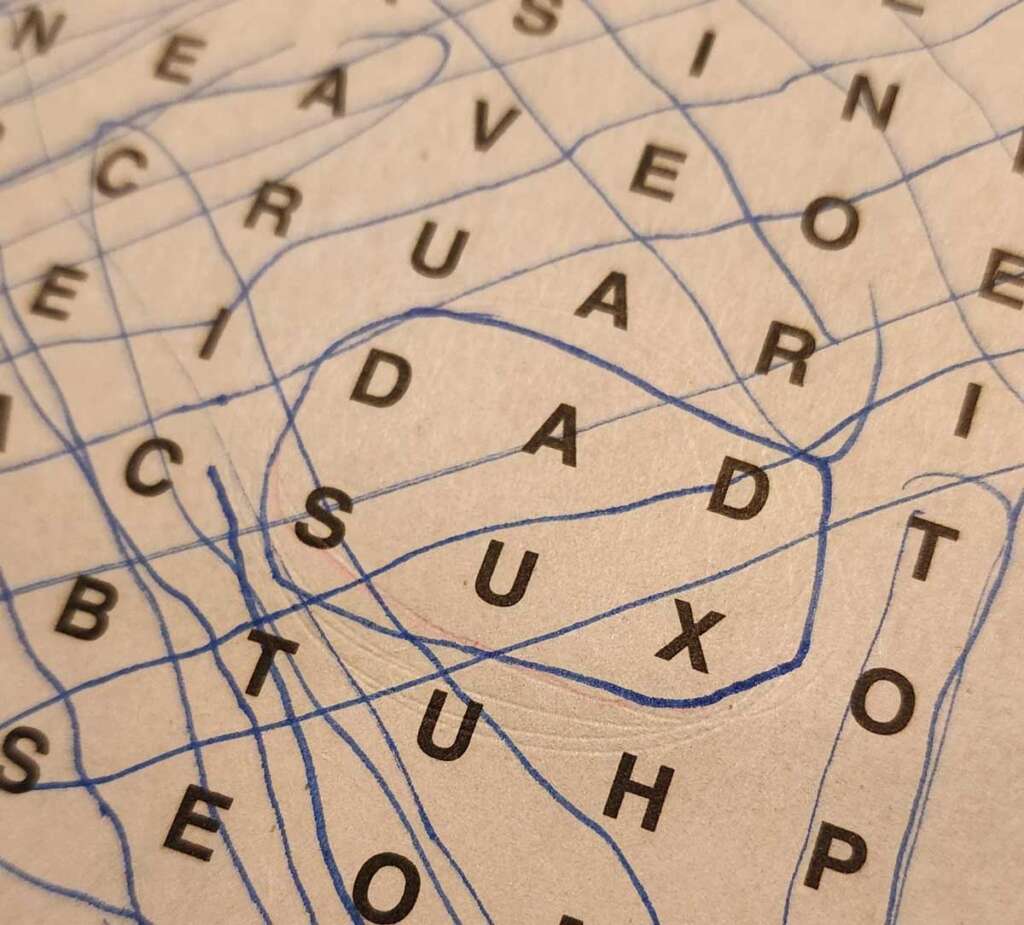 Crossword puzzle with the letters DADSUX circled