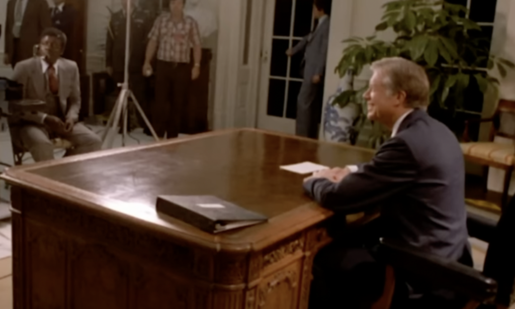 Jimmy Carter at desk. 