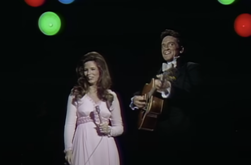 Johnny Cash smiling during duet. 