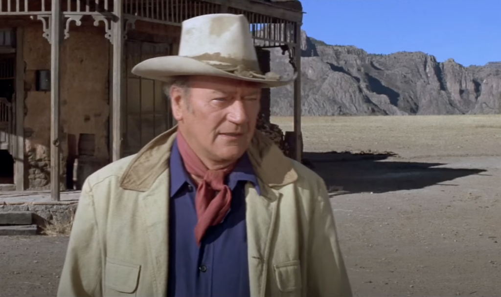 A still image of John Wayne in a movie. 