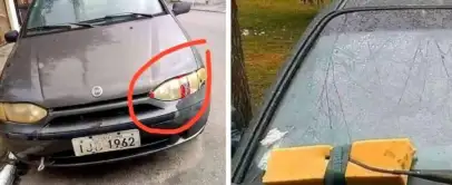 The image shows a car with two unusual features. On the left, one of its headlights is covered with packaging tape. On the right, a squeegee is wedged under the windshield wiper to serve as a replacement.