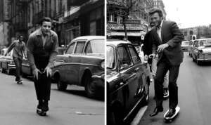 Two black-and-white photos show men in suits skateboarding on city streets. The left image features a man crouched low on a skateboard, while the right shows a man smiling as he rides past vintage cars.