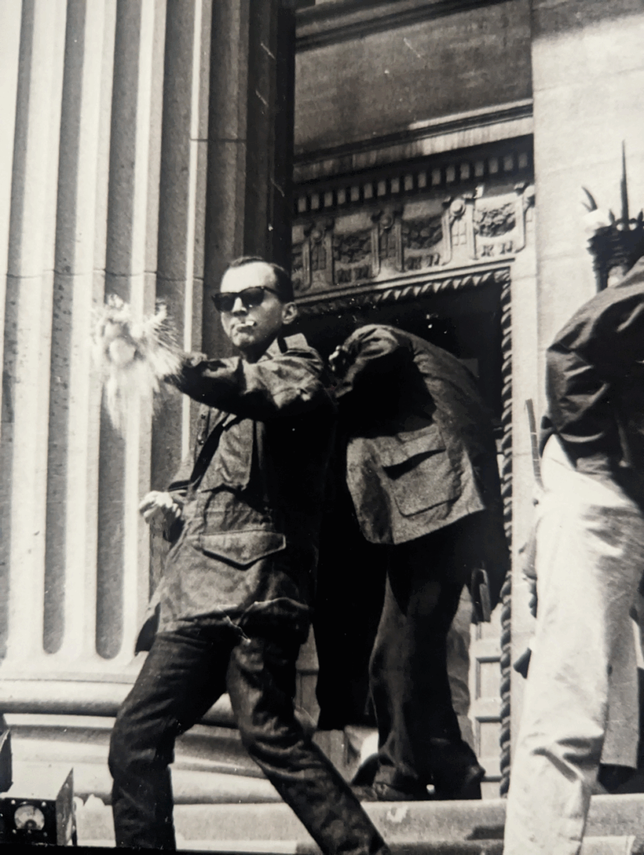 A man wearing sunglasses defending protestors of the Cuban missile crisis.