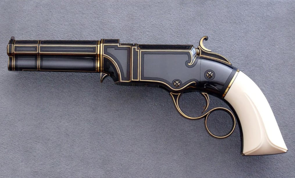 A vintage-style revolver with a black and gold ornate design and a smooth, white handle, displayed on a gray background.
