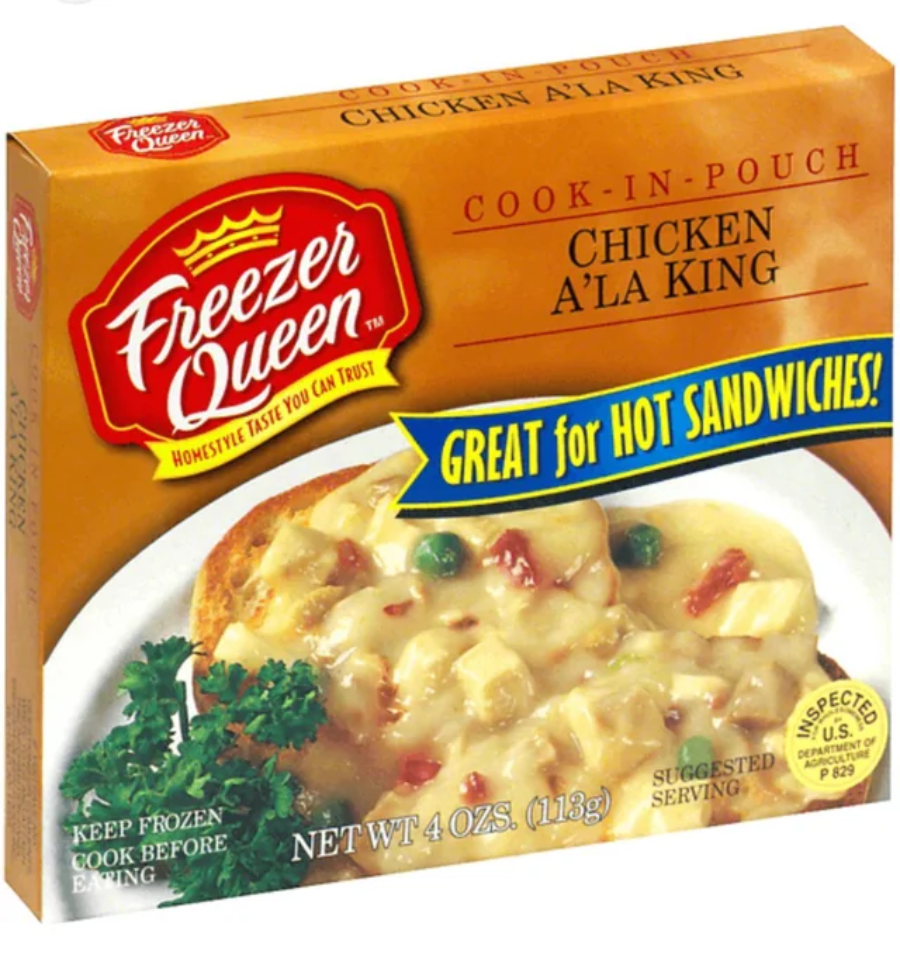 A box of Freezer Queen Chicken A'La King frozen meal, featuring a prepared serving of creamy chicken with vegetables on bread, labeled "Great for hot sandwiches!" in yellow and blue text.