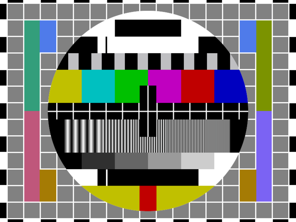 A classic TV test pattern with a central circle, color bars, grayscale gradients, geometric shapes, and black-and-white grid background used for television calibration.