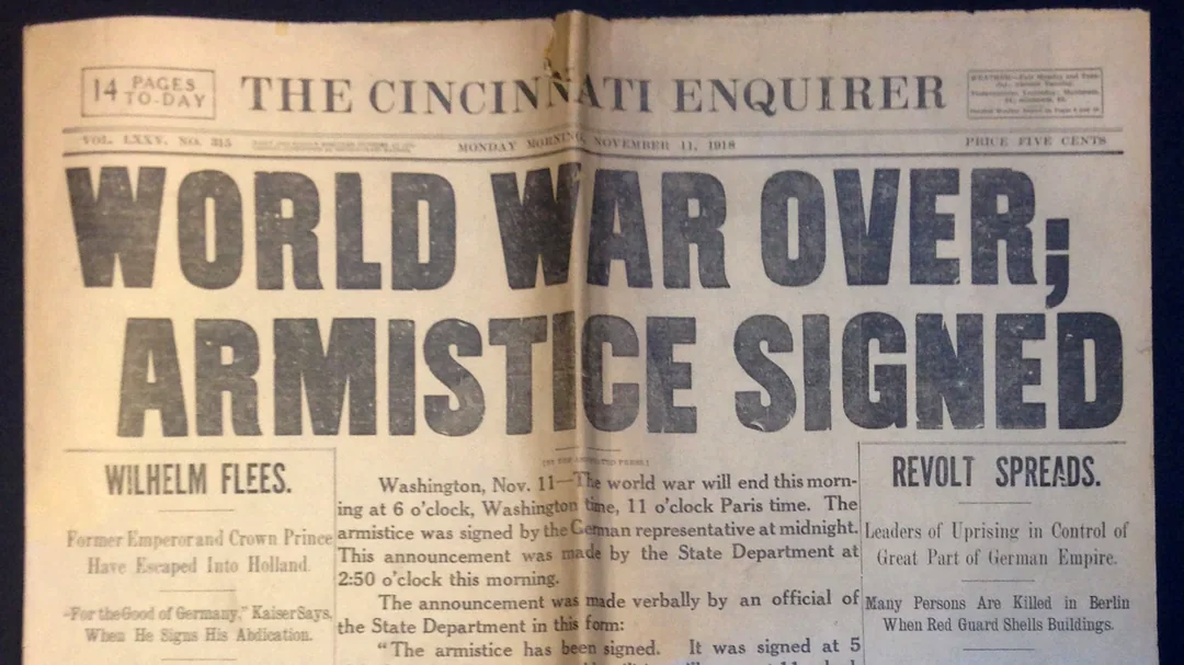 Front page of The Cincinnati Enquirer newspaper dated November 11, 1918, with large headline: "WORLD WAR OVER; ARMISTICE SIGNED," marking the end of World War I. Smaller headlines and articles appear below.