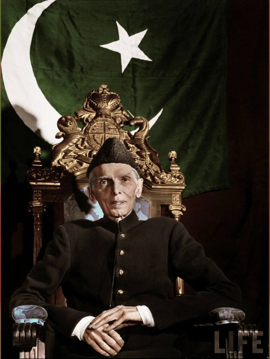 An elderly man in traditional South Asian attire sits on an ornate throne with a green flag featuring a white crescent and star behind him. The image has a "LIFE" magazine watermark in the lower right corner.