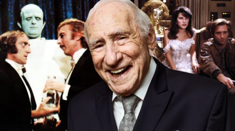 An older man in a suit smiles in the foreground, with scenes from classic comedic science fiction films and various costumed characters in the background.