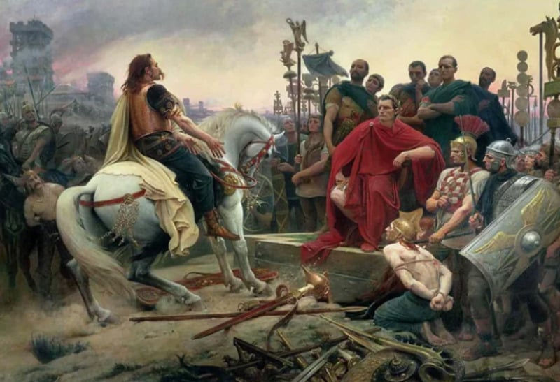 A Roman leader in a red robe sits surrounded by soldiers, facing a defeated warrior on a white horse; weapons and armor lie scattered on the ground, with onlookers in the background.