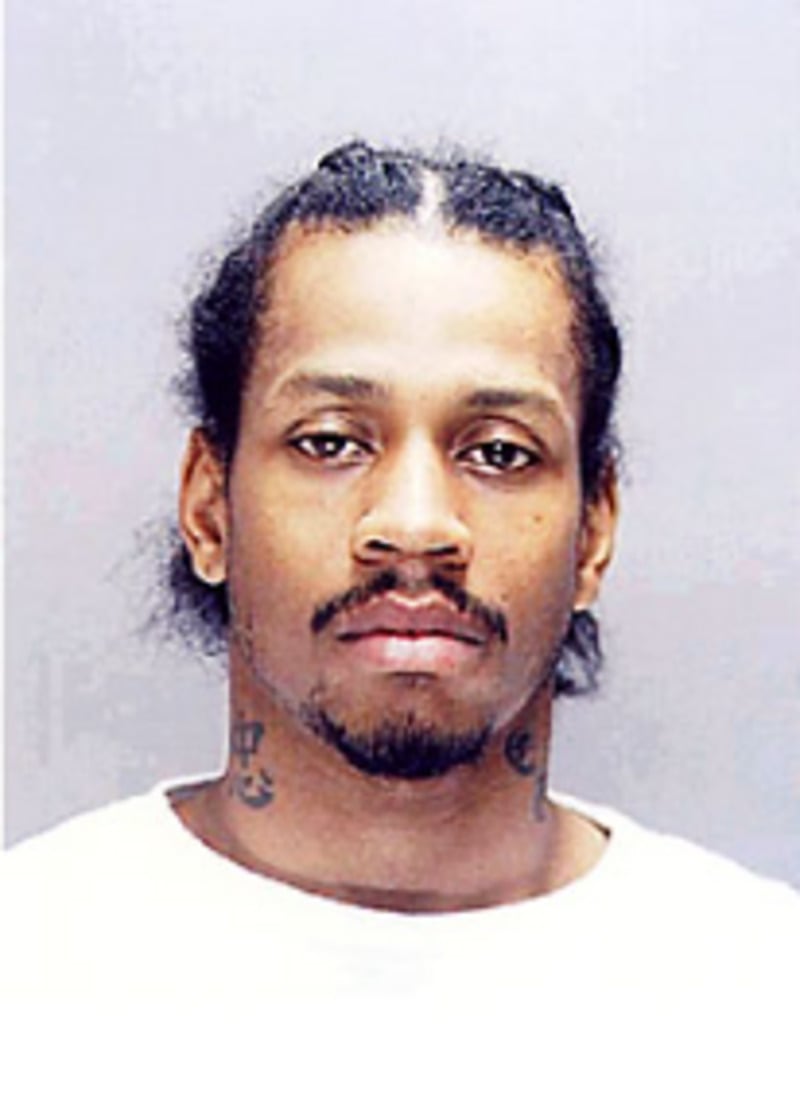 A man with a beard and a white shirt