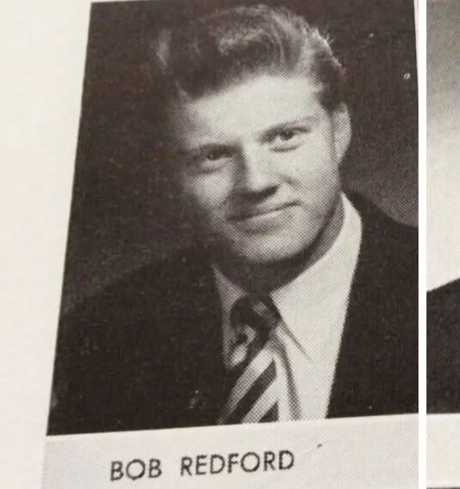 Black-and-white yearbook photo of a young man with neatly styled hair, wearing a suit, collared shirt, and striped tie. The name "BOB REDFORD" is printed below the image.
