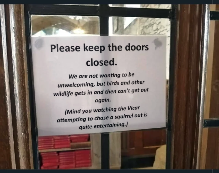 A sign on a glass door reads: "Please keep the doors closed. We are not wanting to be unwelcoming, but birds and other wildlife get in and then can’t get out again.
