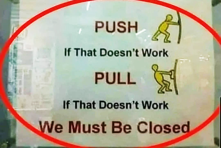 A sign reads: "PUSH. If that doesn't work, PULL. If that doesn't work, We must be closed," with stick figure illustrations pushing and pulling a door. The text is highlighted by a red oval.