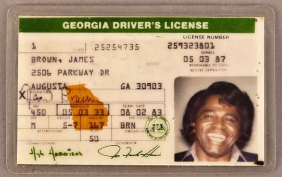 A Georgia driver's license with a photo of a smiling man, personal details, signature, and official stamps. The name on the license is James Brown, and the address and physical descriptions are visible.