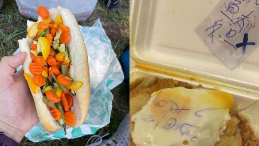 A hand holds a hot dog bun filled with pickled vegetables. Next to it, a takeout container holds a meal topped with melted cheese and a handwritten note inside a plastic bag.