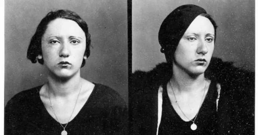 Black and white mugshot-style photos of a woman with short, dark hair, wearing a dark top and necklace. In one image she faces forward; in the other, she is turned slightly to the side and wearing a dark hat.