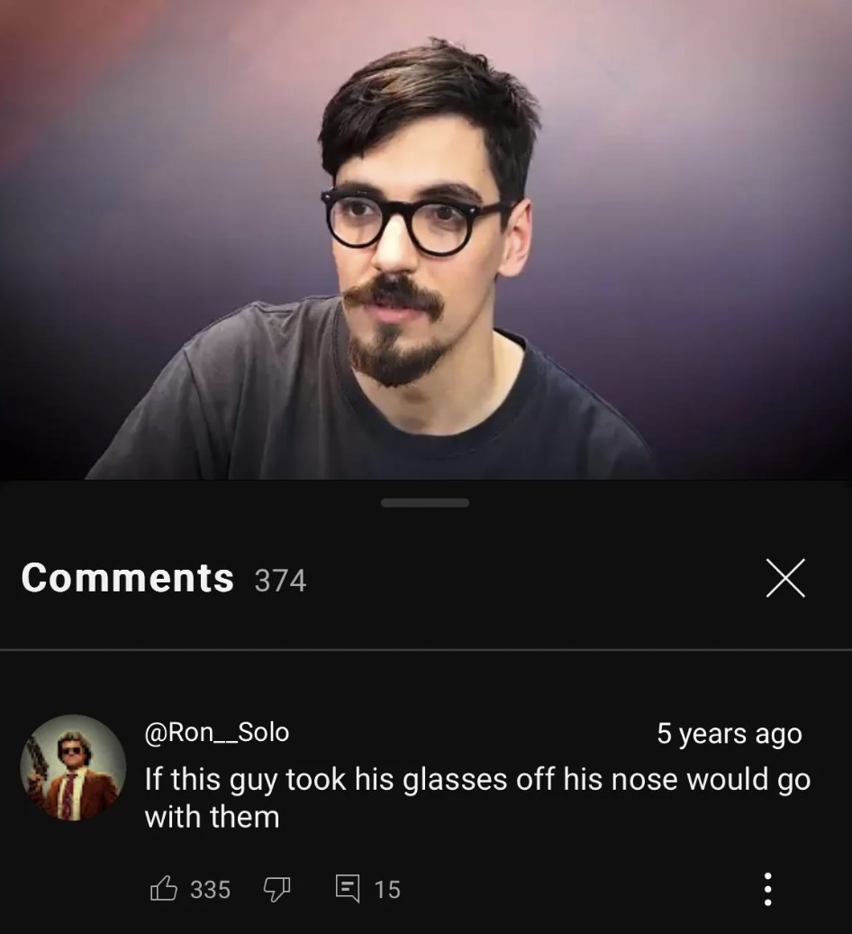 A man with dark hair, a mustache, and round glasses sits in front of a gradient background. Below, a YouTube comment jokes, "If this guy took his glasses off his nose would go with them.