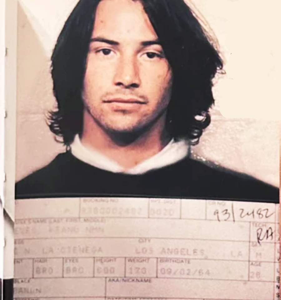 A young man with shoulder-length dark hair poses for a passport-style photo. He wears a black shirt over a white collar. Below the image are personal details such as name, city, and date of birth, partially visible and blurred.