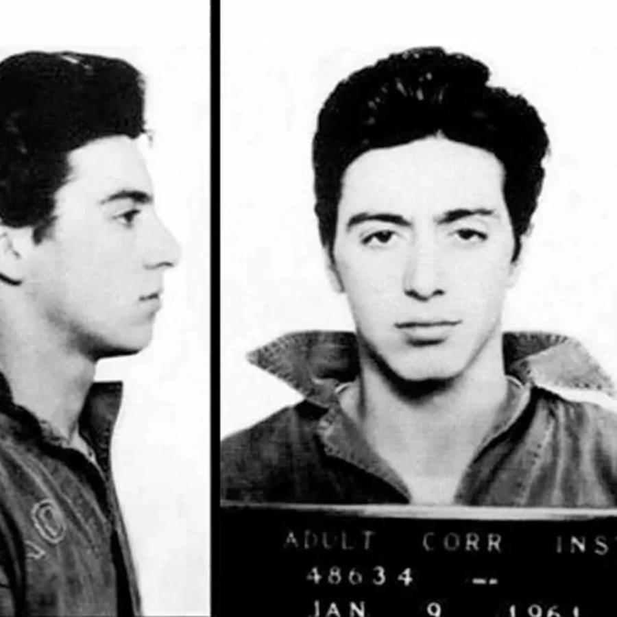 Black and white mugshot of a young man with dark hair, wearing a collared jacket. The image shows both a side profile and a front-facing view. A placard with numbers and a date is visible in the front view.