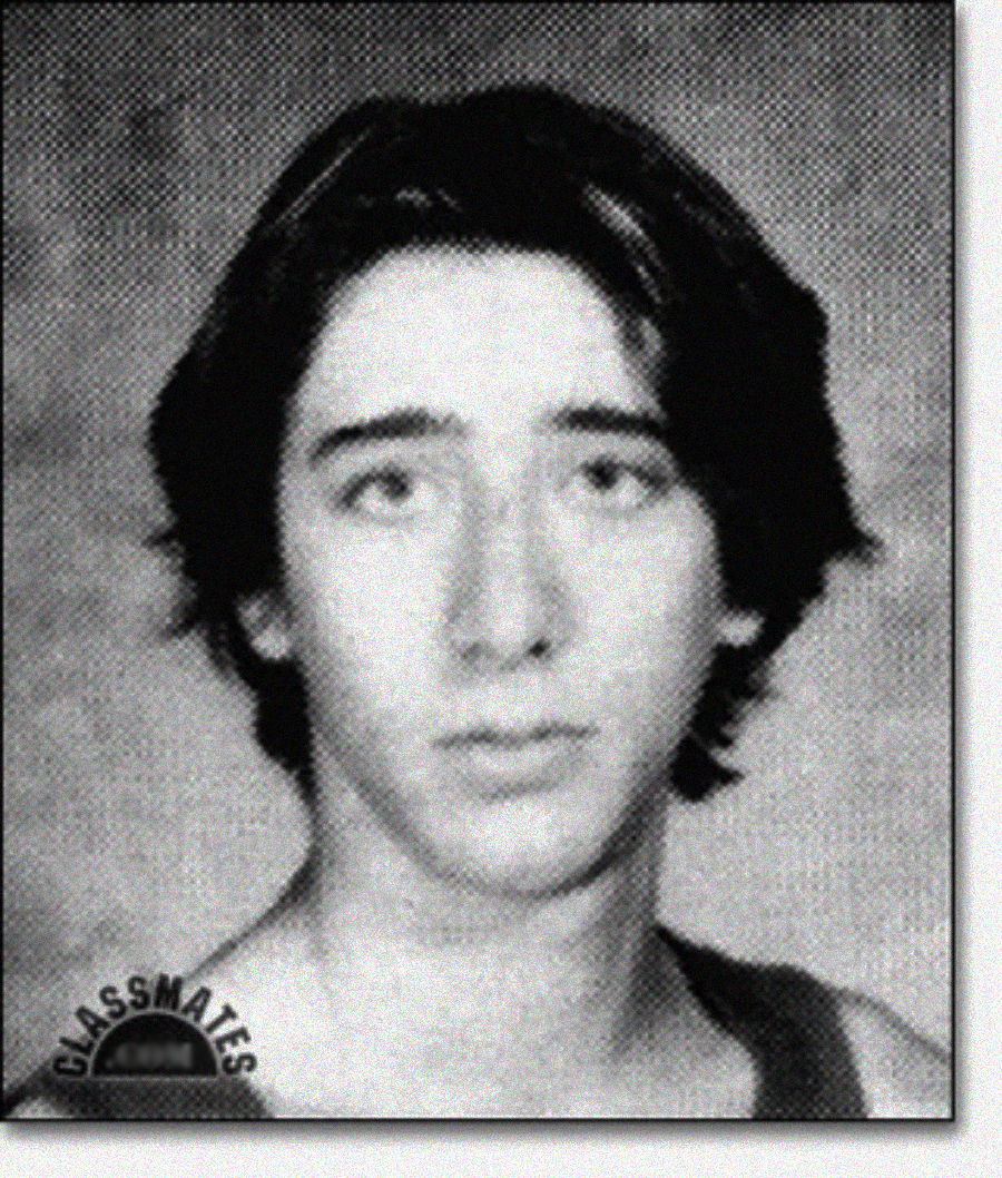 A black and white yearbook-style portrait of a young person with medium-length dark hair, wearing a tank top, looking directly at the camera with a neutral expression. The word "CLASSMATES" appears in the lower left corner.
