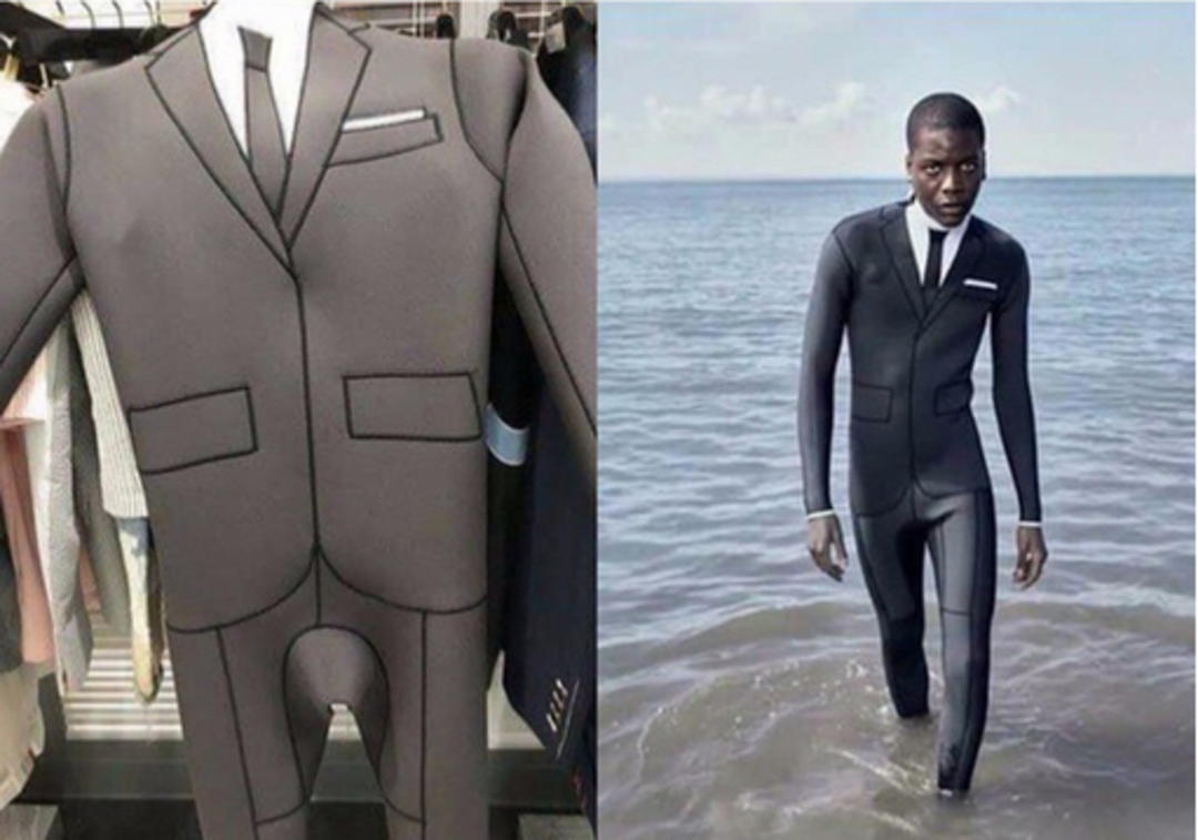 A wetsuit designed to look like a formal suit with a tie and pocket square; on the left, it hangs on a rack, and on the right, a person wears it while walking from the sea.