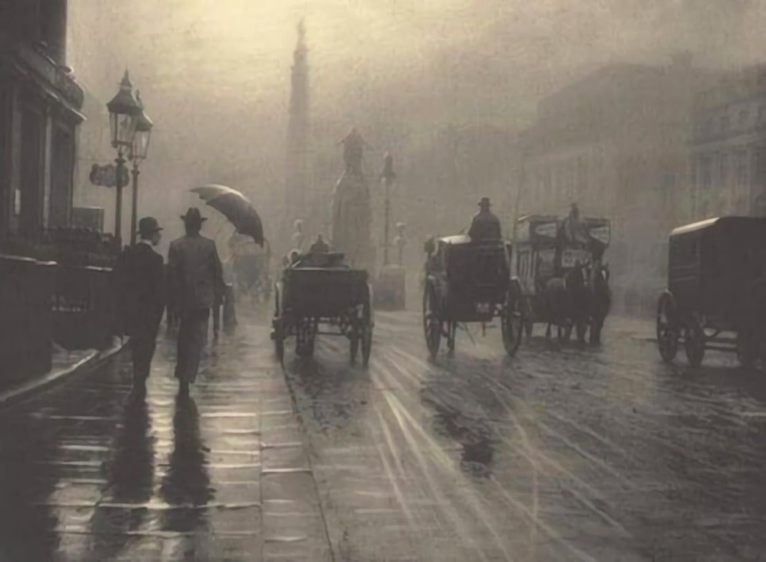 A foggy, old-fashioned city street with people walking, some holding umbrellas, and several horse-drawn carriages moving along wet cobblestone roads under dim streetlights.