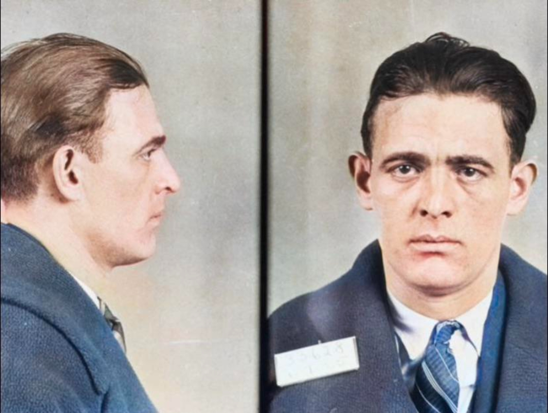 A mugshot featuring two views of a man with short brown hair, wearing a suit, tie, and overcoat. The left image shows his profile, while the right image shows his face looking forward.