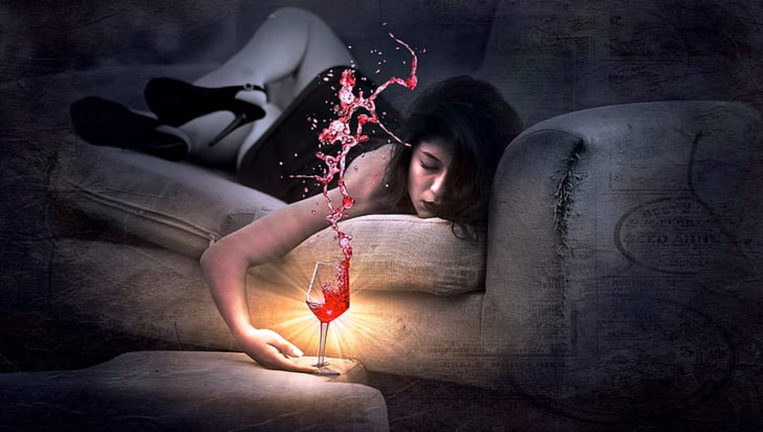 A woman lies on a couch, reaching down to hold a glowing wine glass. Red wine splashes dramatically out of the glass, suspended in mid-air. The scene is dimly lit and surreal.