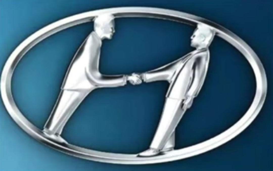 A metallic logo shows two silver, stylized human figures shaking hands, forming the shape of an "H" inside an oval frame on a blue background.